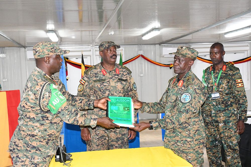 Commander Land Forces (CLF) witnessing a change of command as Brig. Gen. Joseph Musoke Ssemwang hands over the office to the incoming CONTICO Brig. Gen. Jackson Kayanja. (Courtesy)