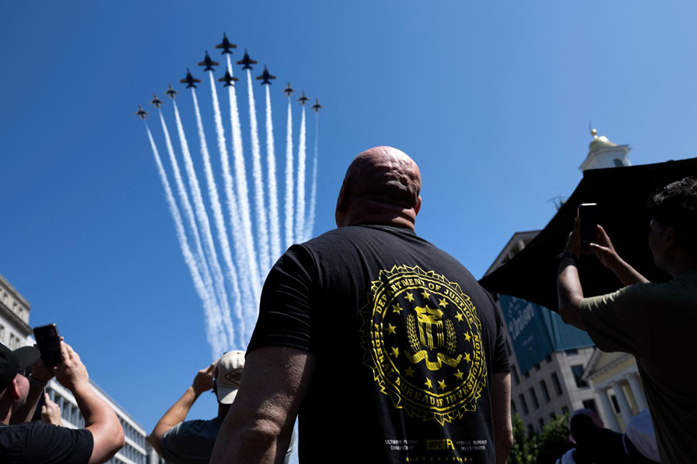 Dana White, President and CEO of Ultimate Fighting Championship (UFC), watches as US military jets practice a flyover ahead of the UFC Freedom 250 event at the White House in Washington, DC on June 12, 2026. The UFC Freedom 250 event will be held on the South Lawn of the White House on US President Donald Trump's 80th birthday on June 14. (Photo by Brendan Smialowski / AFP)