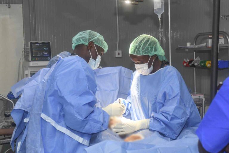 Lt. Dr. Victoria Namagga and a colleague during surgery at a hospital in Mogadishu.