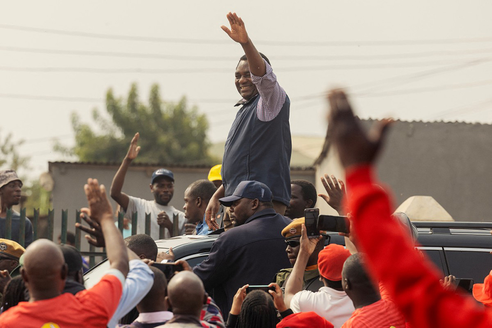 Zambian incumbent President and United Party for National Development (UPND) presidential candidate Hakainde Hichilema waves at supporters as he arrives for an elections campaign rally in Lusaka on August 11, 2026. (AFP)