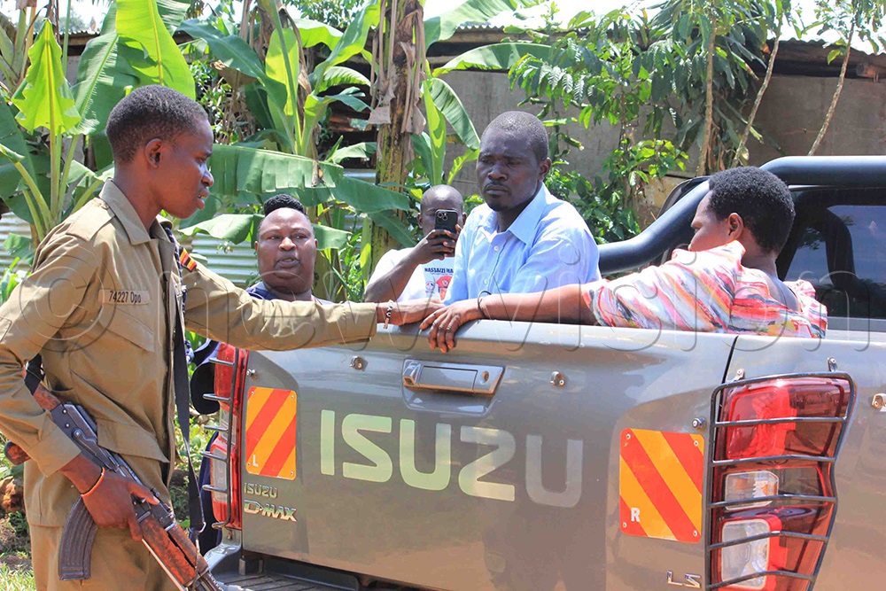The suspects in the vehicle which transported them to Naggalama Police Station. (Photo by Henry Nsubuga)