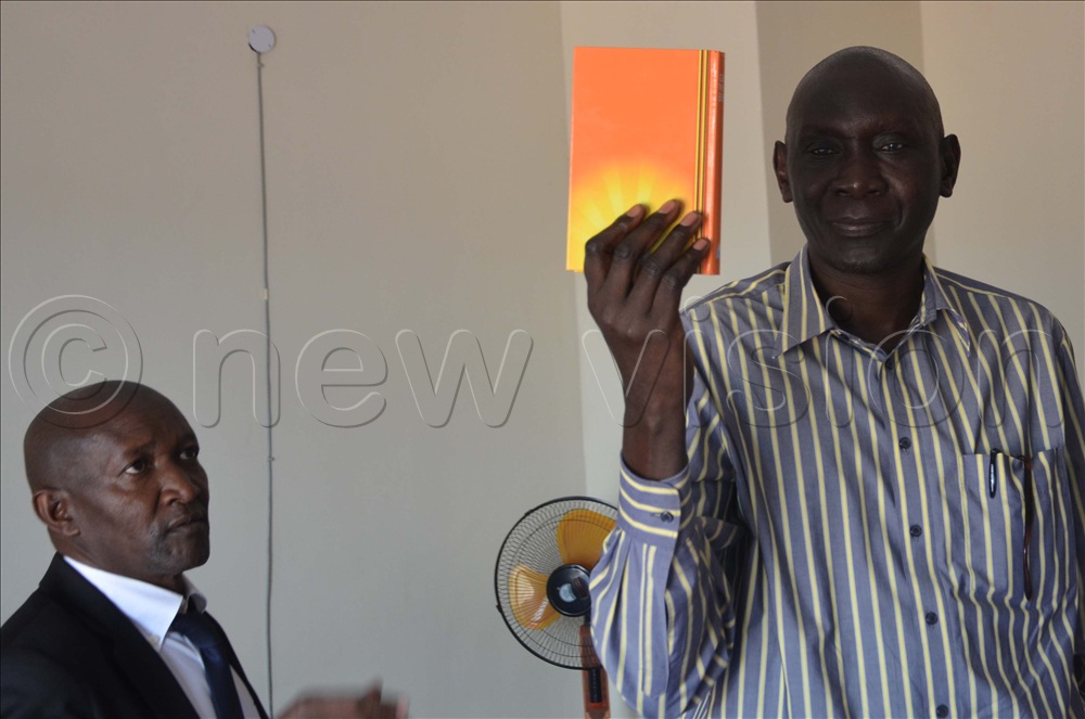 Isaac Ojok, a complainant taking oaths during Tribunal on Wednesday.