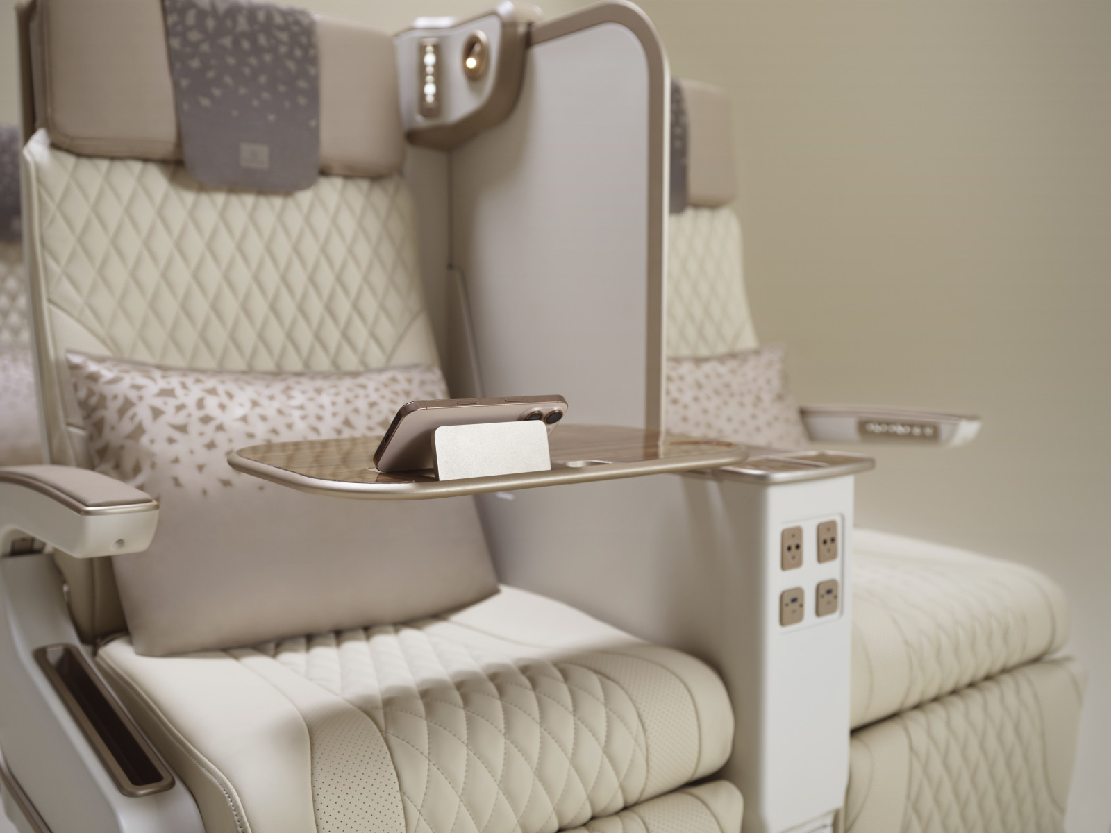 Emirates’ new electric premium economy seat featuring an integrated phone holder. (Courtesy)