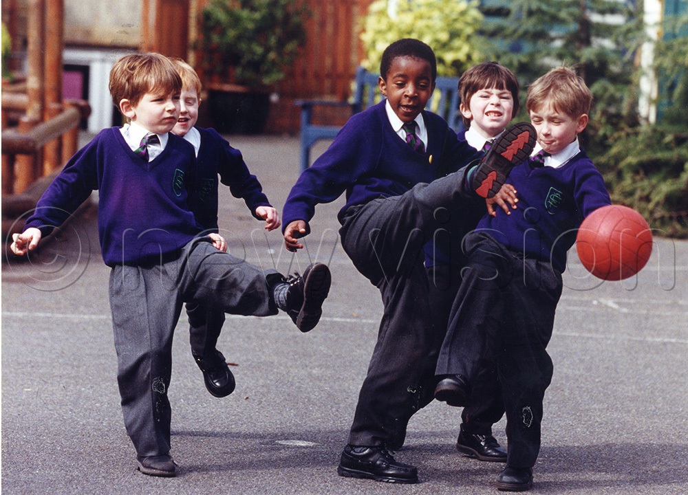 King Oyo (middle) playing with his school mates. (New Vision Archives)
