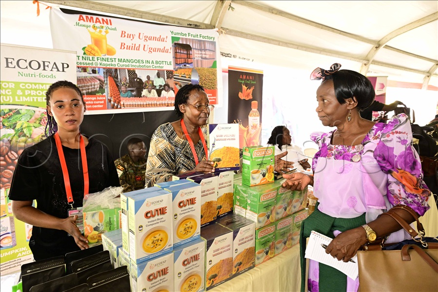 Women showcasing composite flour at Kololo. (Credit: Eddie Ssejjoba)