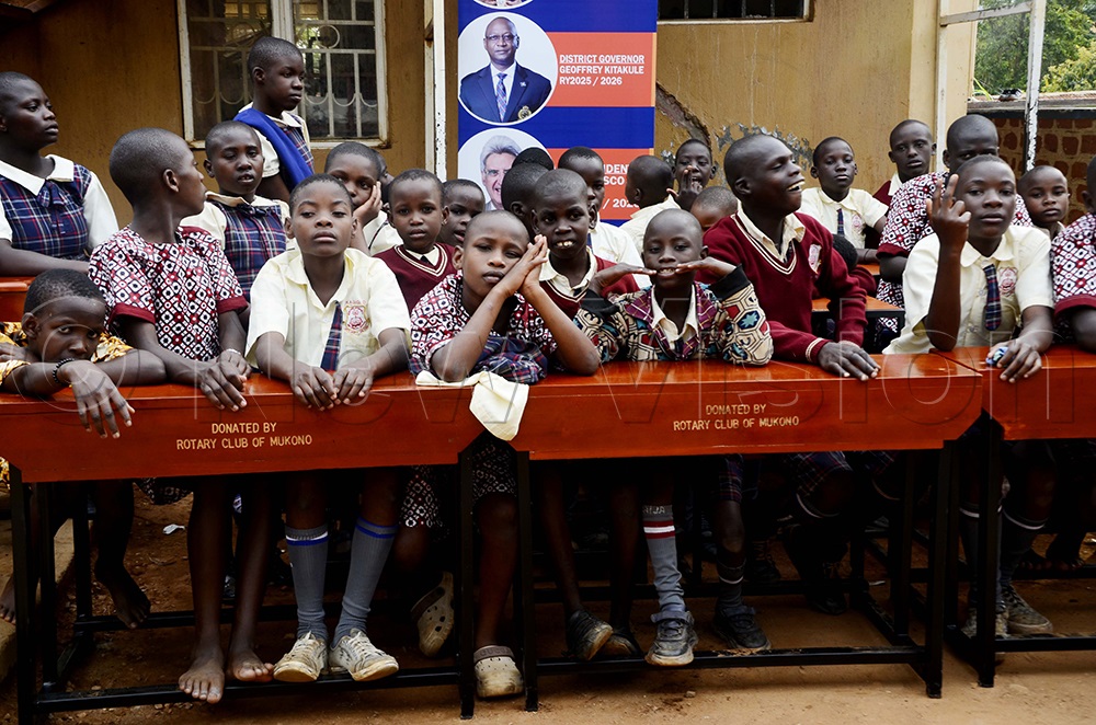 Special needs children siting on some of the desks donated by Rotary Club of Mukono during the handover at Mukono Municipal Special Needs Education Primary School on 17th October 2025. (Photo by Juliet Kasirye)