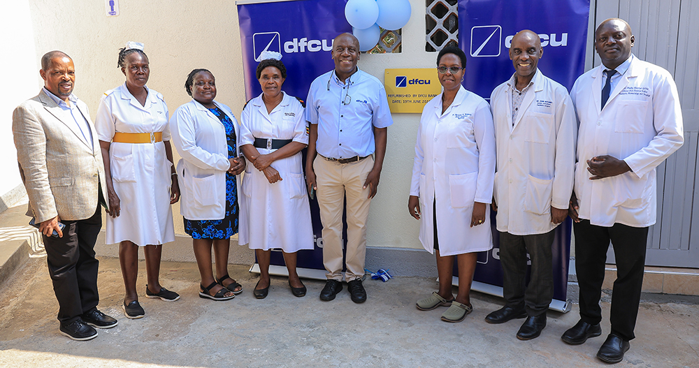dfcu Bank Chief Executive Officer Charles Mudiwa and representatives from Mulago National Referral Hospital during the handover of the refurbished facility at the hospital’s Sickle Cell Clinic.