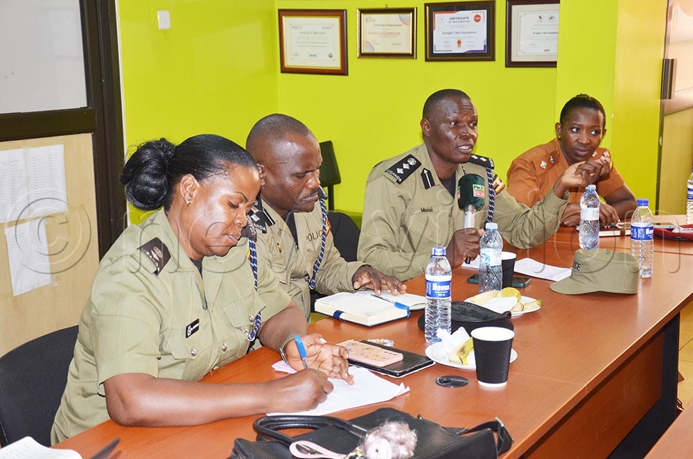 Police officers who included Richard Musisi (speaking), political commissar Lameck Kigozi (second left), and a prison warder during the workshop. (Credit: Isaac Nuwagaba)