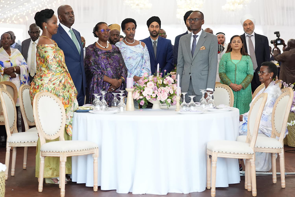 The Karugires (centre) with family and friends.