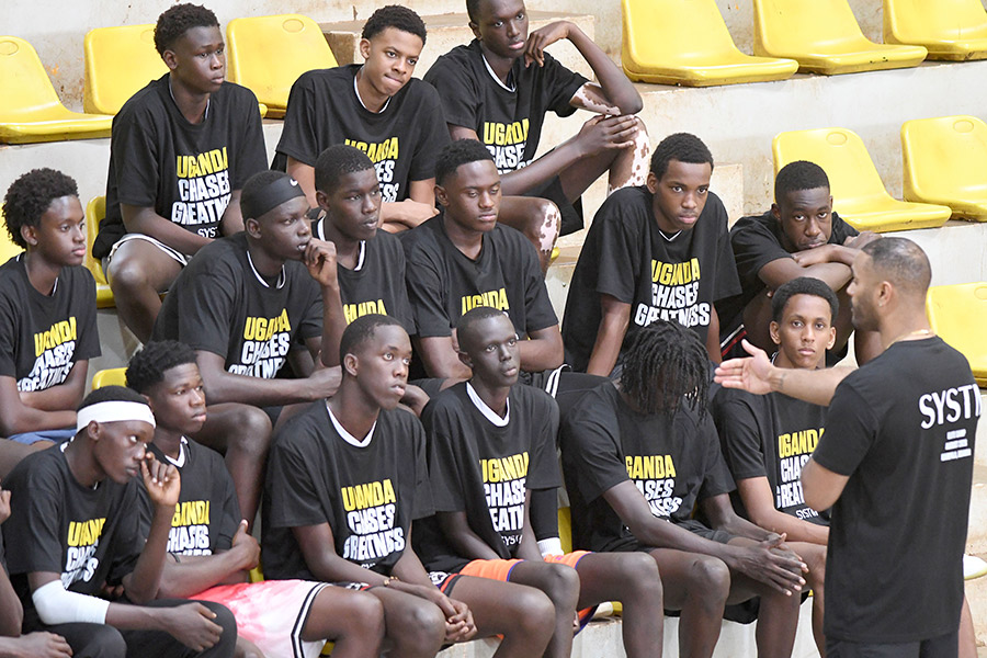 SYSTM Sports President Dimitrios Seymour (right) speaks to the basketball camp participants at Lugogo, August 26, 2026. Photo by Michael Nsubuga
