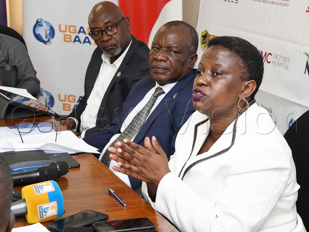 Rosemary Kisembo, Executive Director National Identification and Registration Authority (right) addressing the media as UMA Chairman Deo Kayemba (middle) and Eddie Senkumba, chairman of the communication, marketing and Events subcommittee looks on. 