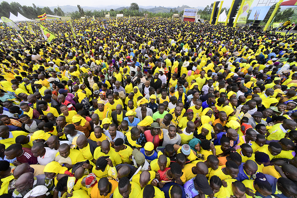 NRM supporters listening to president Museveni's address at the campaign rally on Wednesday (Dec. 3). (PPU)
