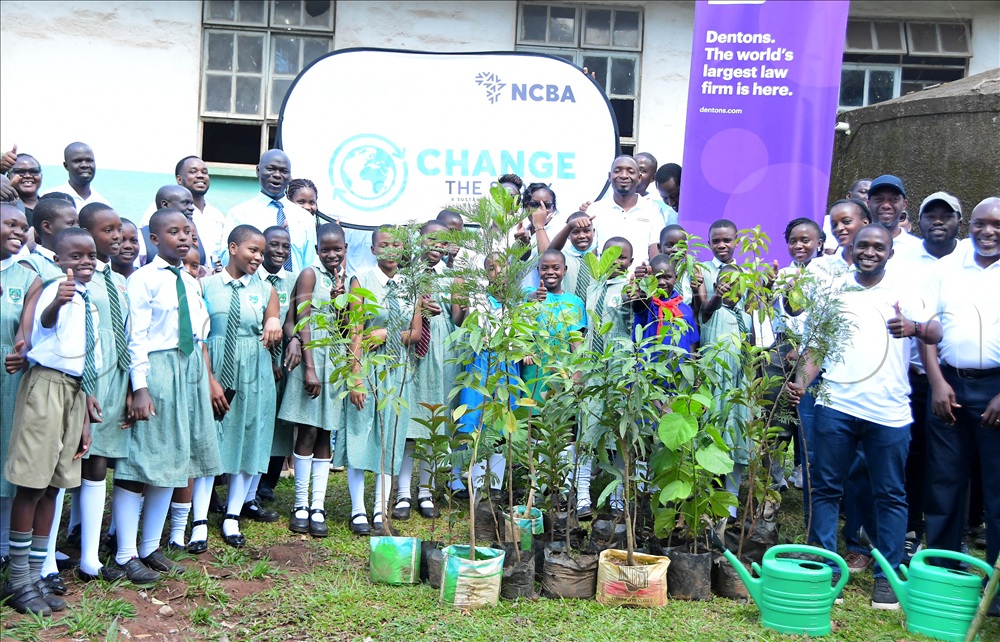 NCBA Bank officials with the Nakasero P.S community at the tree planting joint project between the bank and the school to mark World Environment Day on June 5.