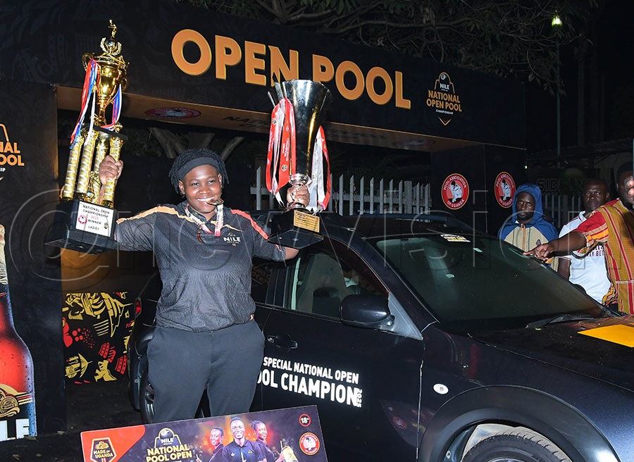 Rashida Mutesi celebrates with the trophies and the car she won in the 2025 National Pool Open. Photo: Silvano Kibuuka