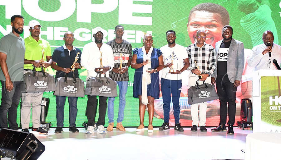 The top individual players pose with UGC Chairman Paul Nuwagaba (2nd left), Equity Bank's Gift Shoko (3rd right) and Watoto Church's Julius Rwotlonyo (2nd right)  at Kitante. Photo by Michael Nsubuga