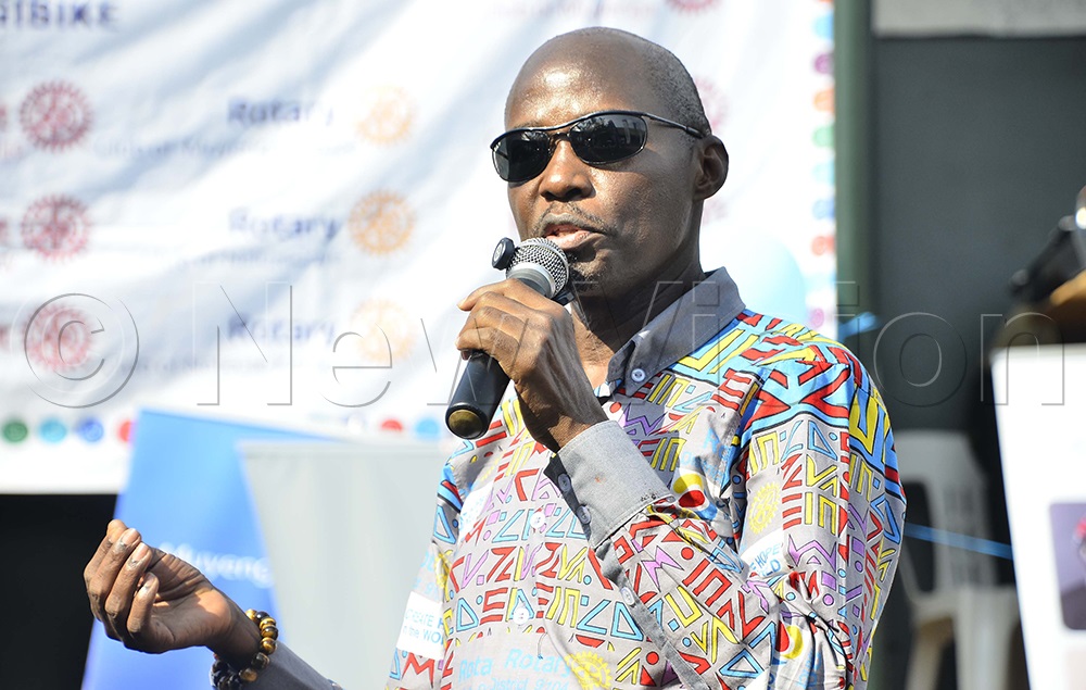 Ken Mugisha, Past District Governor, addressing Rotarians during the commissioning of the school library at Kansanga Primary School in Makindye Division on Friday, August 7, 2026. (Photo by Juliet Kasirye)