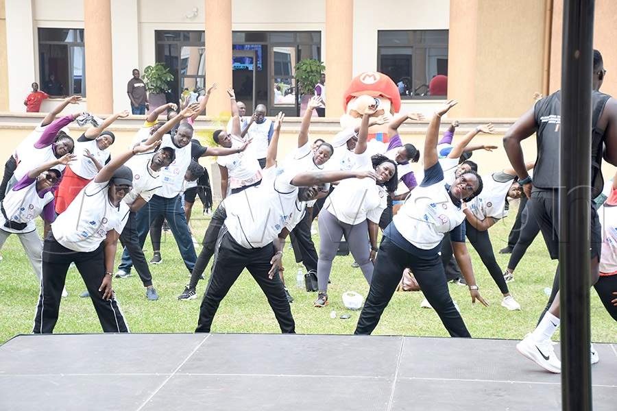 UJOA president Daphine Ayebare (2nd right-front) and the deputy chief justice of Uganda Justice Moses Kazibwe Kawumi (center) engage in an aerobic session with other judges after the Judges Walk at the High Court. Photo by Michael Nsubuga