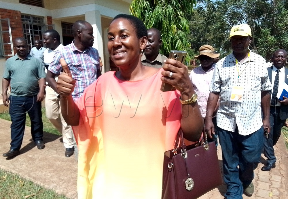 Excited Angella Akoth walks out of court on Tuesday after the ruling was made. (Photo by Faustine Odeke)