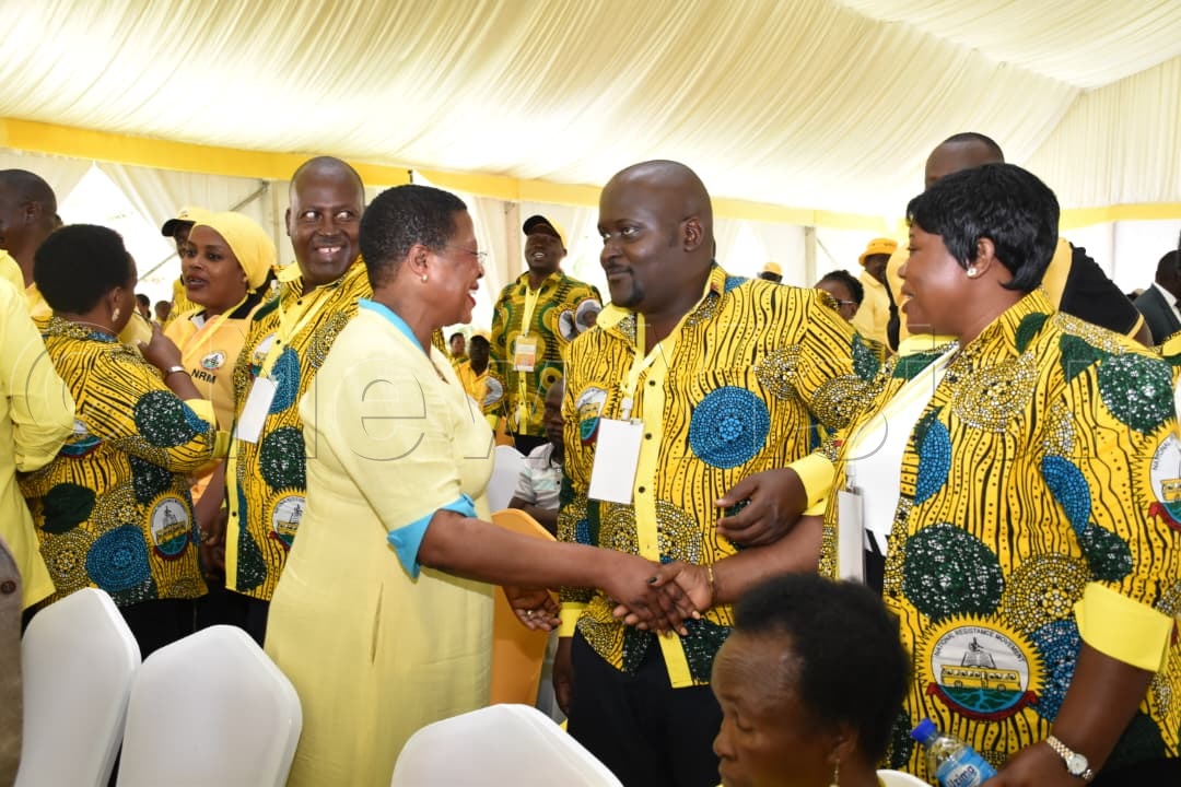 Speaker of parliament sharing a light moment with delegates at the NEC meeting.