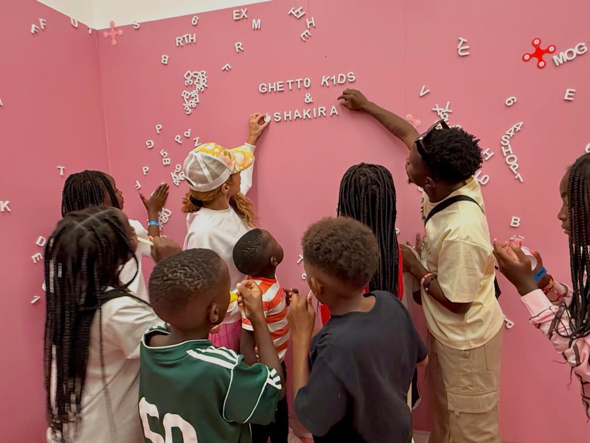 Musician Shakira posing with the Ghetto Kids