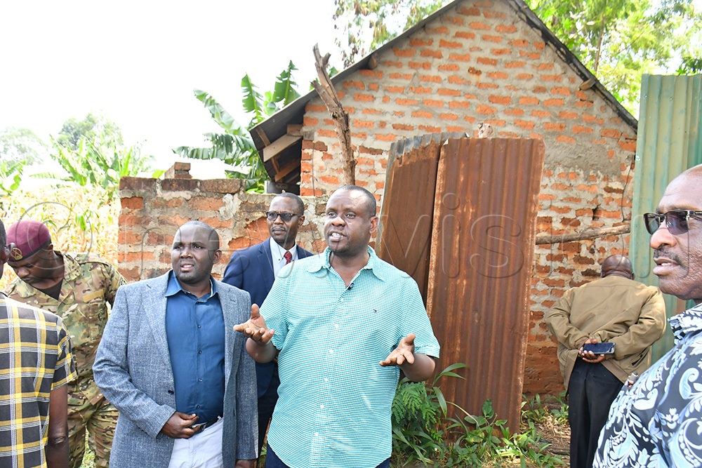 The Minister of Local Government Balaam Barugahara (C) addressing local leaders during inspection of a sh73m pitless toilet constructed at Muyembe Health Centre IV. Looking on are PLU's Secretary General Fadil Twalla (2nd L) and the State Minister of Gender, Labour and Social Development in charge Employment and Industrial Relations, Simon Mulongo (R). (Photo by Donald Kiirya)
