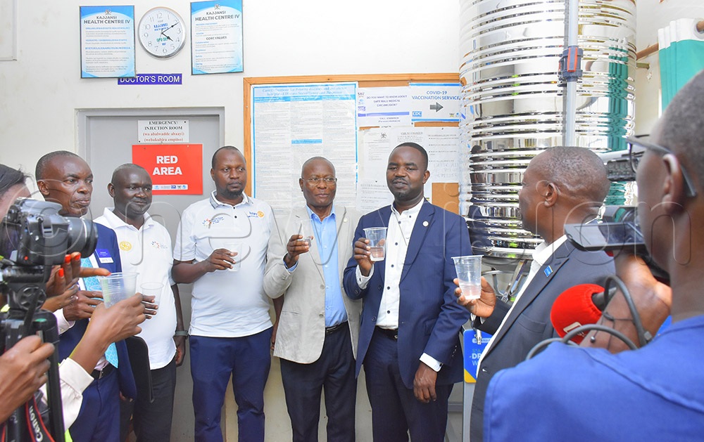 Rotarians toasting to the safe drinking water donated to Kajjansi health centre IV during their visit to the facility on Friday. (Credit: Julius Luwemba)
