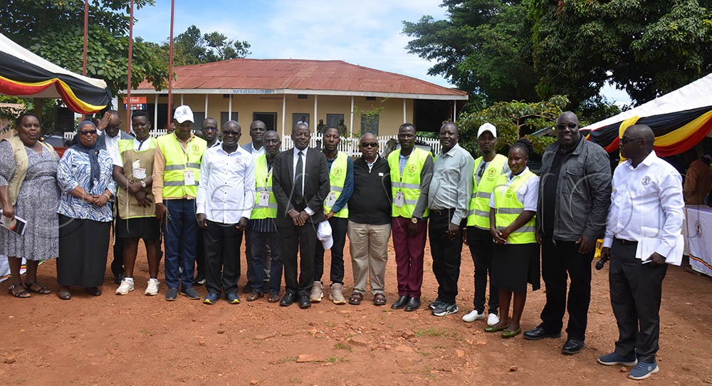 Justice Simon Byabakama with commissioners and electoral commission officials from Kalangala District. (Credit: Samuel Nkuba)