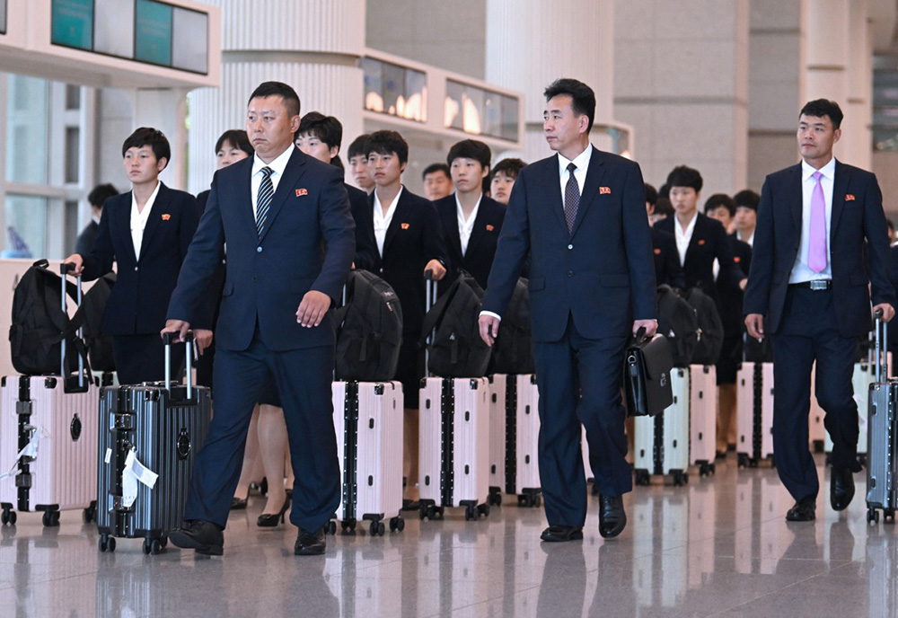 North Korea's Naegohyang Women's FC players and staff arrive at Incheon International Airport in Incheon on May 17, 2026, ahead of the Women's Asian Champions League semi-final football match against South Korea's Suwon FC Women. (Photo by Jung Yeon-je / AFP)