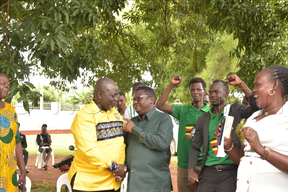 Democratic Party (DP) president general Norbert Mao with Tony Kitara, the NRM flag bearer for Pece-Laroo Division in Gulu city.