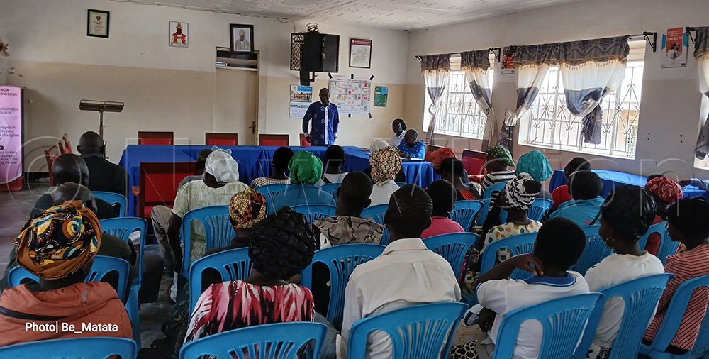 The Diocesan Secretary briefing the pilgrims at the diocesan headquarters. (Photo by Prossy Nankanja)