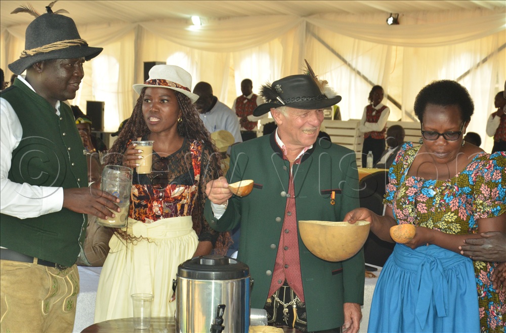 Gulu city mayor, Alfred Okwonga, Dr. Wolfgang Wiedmann, Uganda representative to the German honorary consul who represented the Mayor of Munich city and Jolly Laker enjoying Kwete during Oktoberfest. 