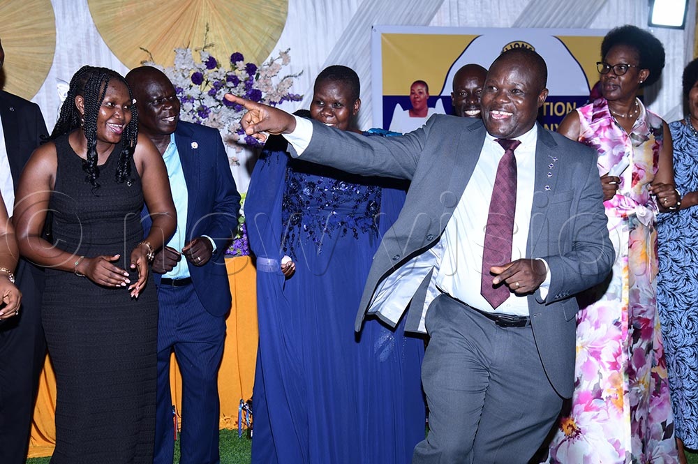 Dr John Ekure leading Lions in a dance for celebrating the installation of Dr Alungat who is behind him. (Credit: Godfrey Ojore)