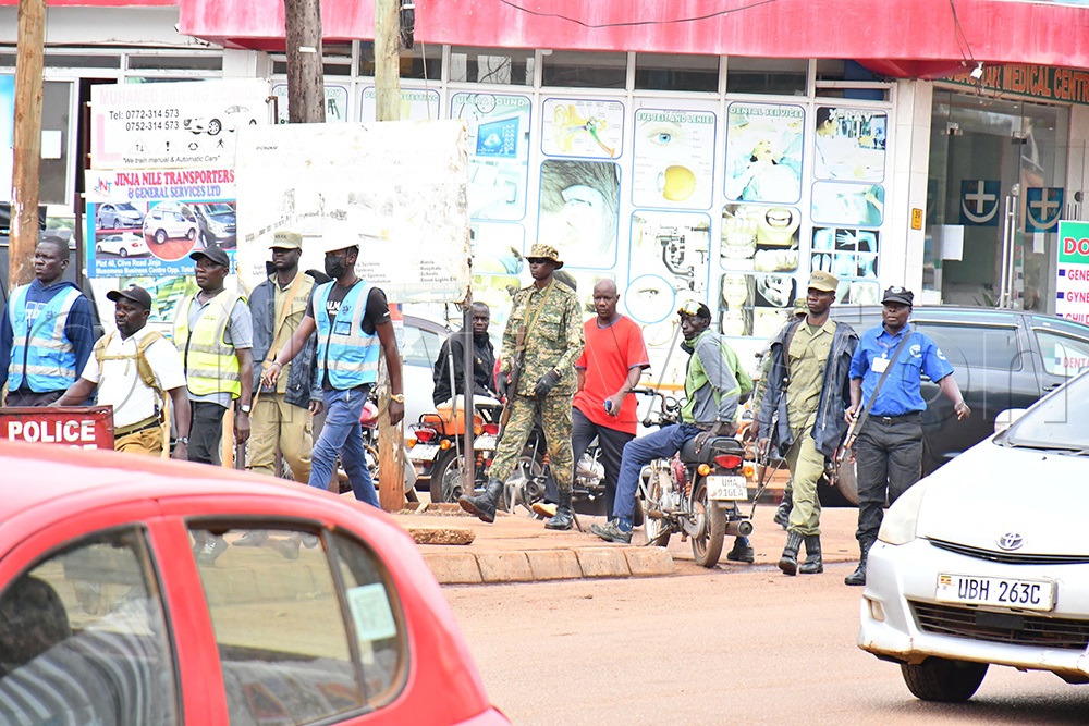Jinja City law enforcement officers, accompanied by UPDF soldiers and police officers, arrive at Kiyembe C Stage in Jinja City before clashing with taxi drivers on Wednesday, July 15, 2026. (Photo by Donald Kiirya)