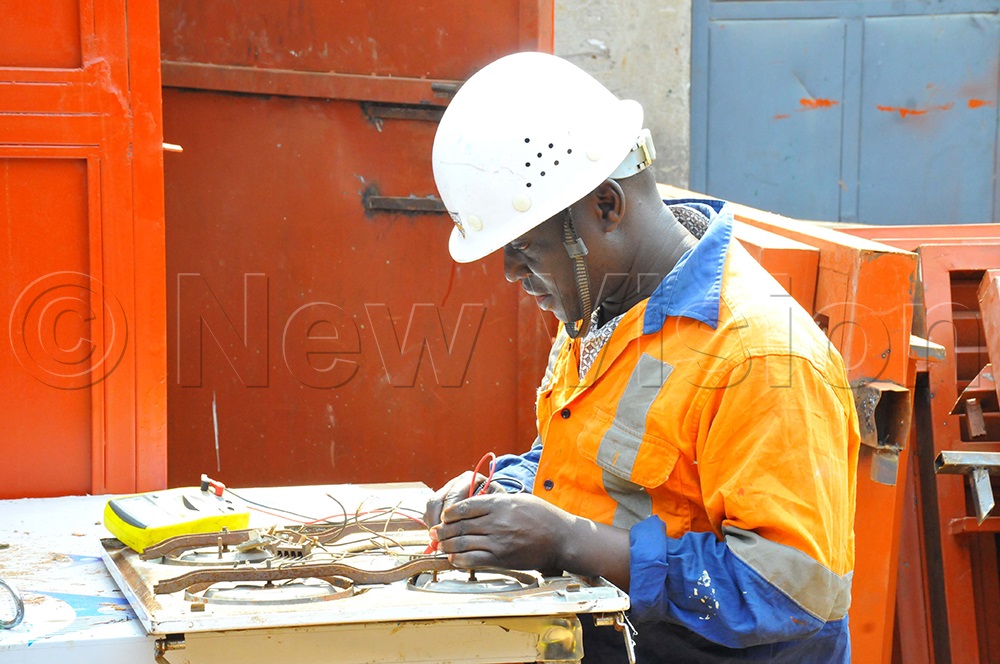 Engineer Joseph Ochuli carrying his works in a workshop at Ntinda market in Kampala. (Photo by Wilfred Sanya)