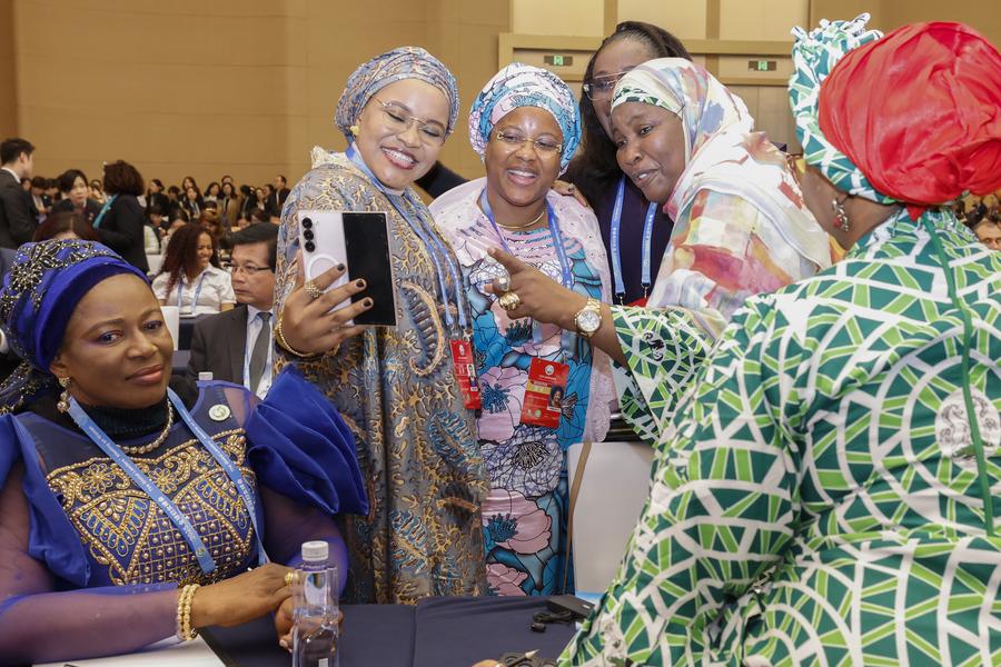 Participants make a video call while attending the Global Leaders' Meeting on Women in Beijing, capital of China, Oct. 13, 2025. The Global Leaders' Meeting on Women was held in Beijing on Monday. (Xinhua/Zhang Yuwei)