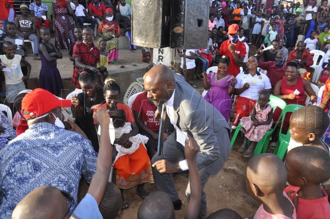 Kasasa (left) performing at Mbidde's rally earlier on Tuesday. Photos by Ssenabulya Baagalayina