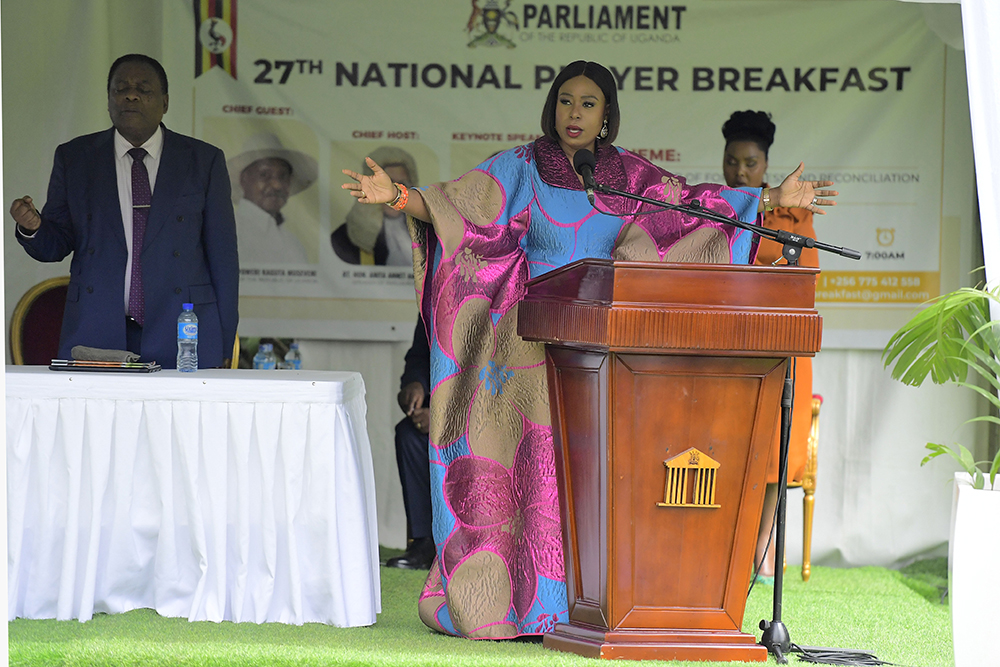 Apostle Isi Igenegba praying for Uganda at the 27th National Prayer Breakfast. (PPU)