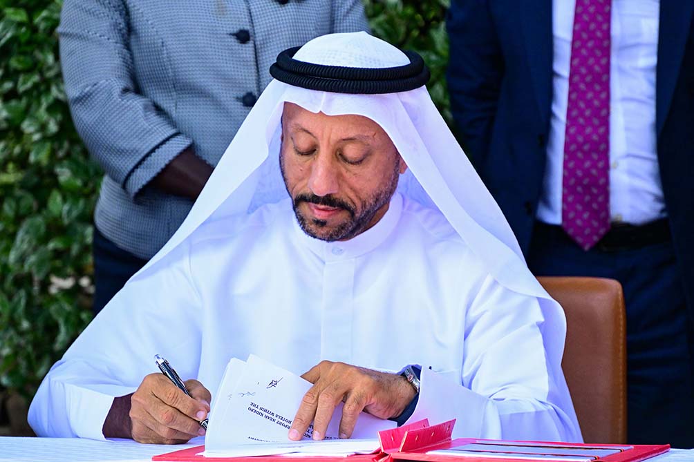 H.e Abdallah Sultan Al Owais The Chairman Of Sharjah Chamber Of Commerce And Industry Of The Uae Signs The Mou During A Meeting At Munyonyo On Thursday. Ppu Photo