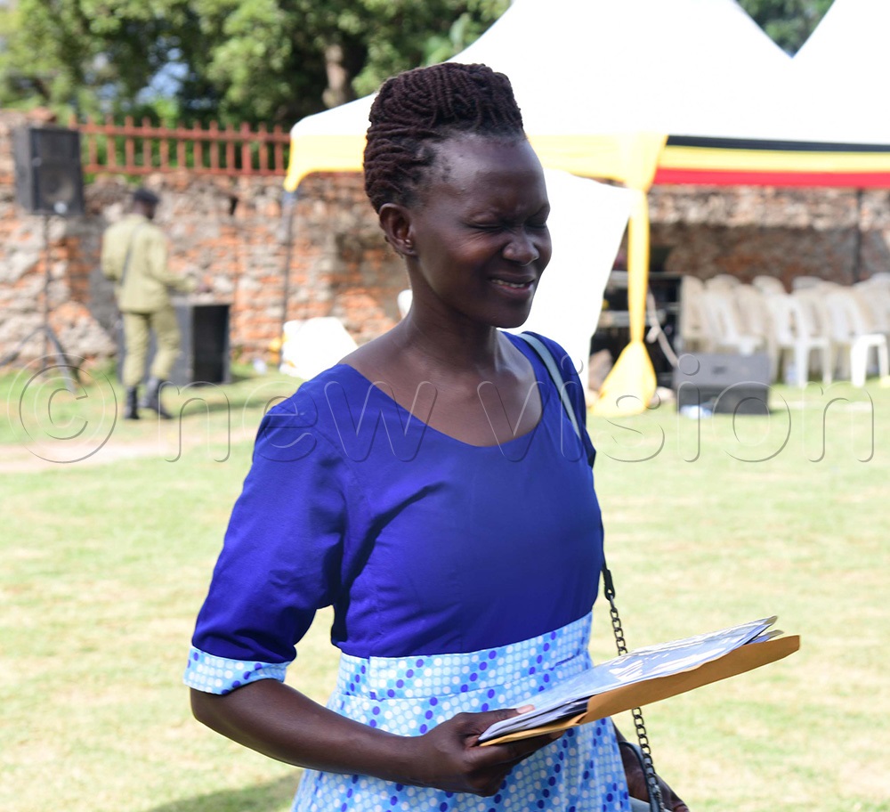 Frances Clare Apolot of FDC trying to avoid the cameras after being bounced. (Photo by Godfrey Ojore)