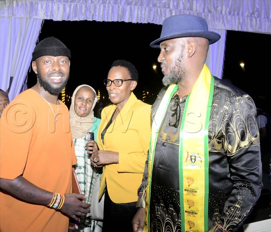Singer Eddy Kenzo interacting with Ruth Rujoki Mushabe (/center) and husband, Dan Mushabe at a recent function at Speke Resort Munyonyo.