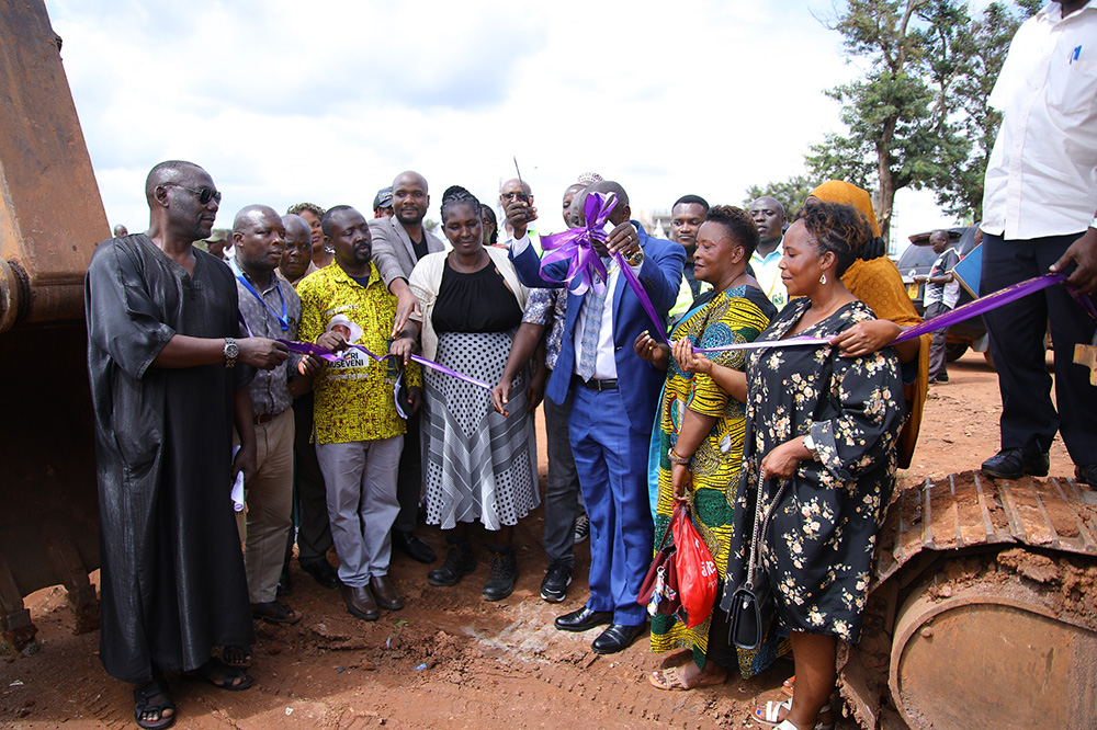 State Minister for Kampala, Kabuye Kyofatogabye (in suit), launches works on the 1.6km road project in Nansana Municipality (Nabweru South I). (Courtesy photo)