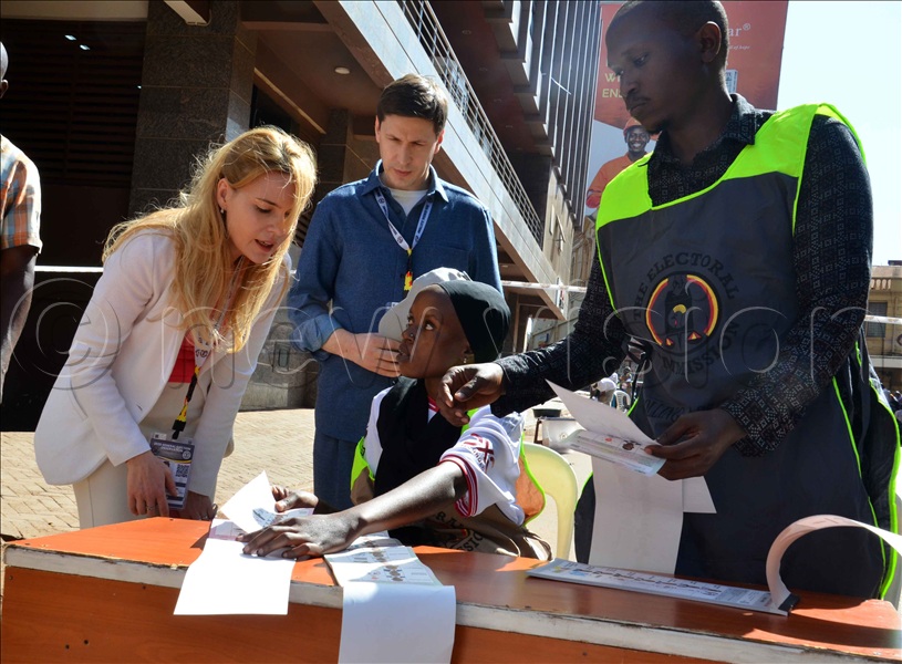 Russian election observers interact with a female returning officer at William Street on Thursday, January 15, 2026.