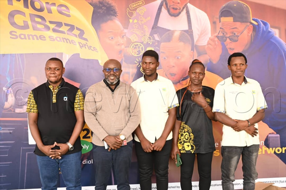 MTN team having a photo moment with Vision Group CEO, Don Wanyama