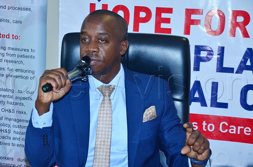 State Minister in charge of primary health care, Dr Charles Ayume, addressing guests during a press conference on hip replacement surgery. (Credit: Agnes Kyotalengerire)
