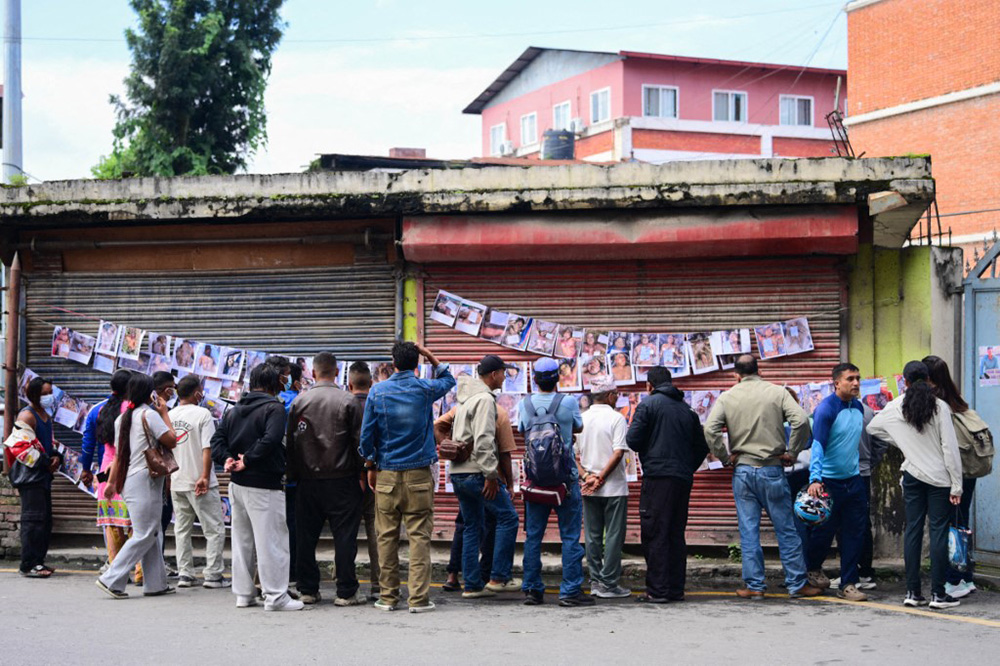 Relatives search for information about missing family members at Tribhuvan University Teaching Hospital in Kathmandu, Nepal, on August 30, 2026, four days after devastating flash floods struck areas near the Nepal-China border. (Photo by Safal Prakash Shrestha / Anadolu via AFP)