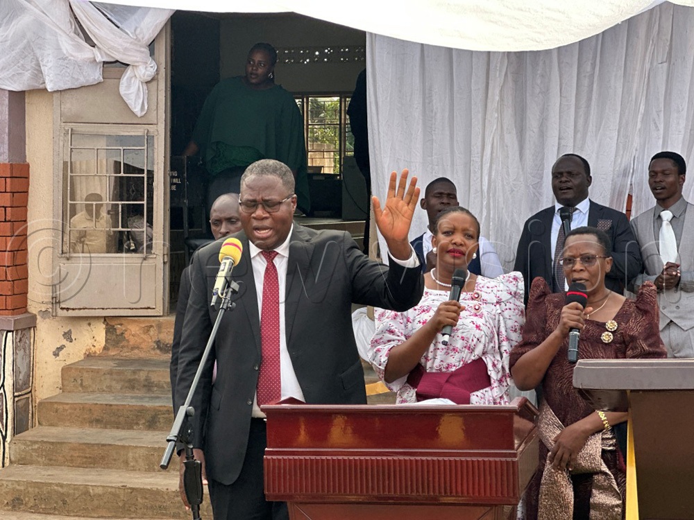 Speaker raising his hands during Prayer and thanksgiving organised by Mukono Inter Faith Forum held at Mt. Lebaon Christian Centre. (Photo by Eric Yiga)