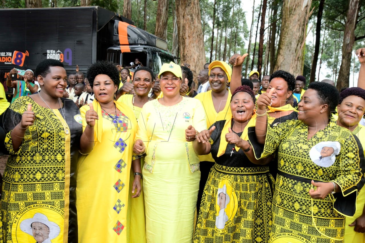 Speaker of Parliament, Anitah Among (c), posing for group photo with NRM supporters.
