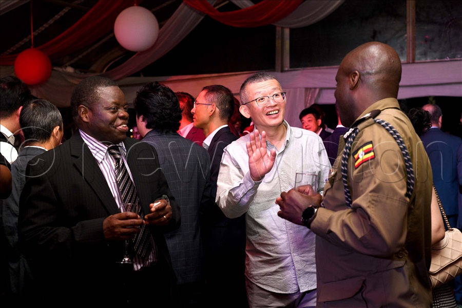  Guests interact during the 76th anniversary of the People's Republic of China.