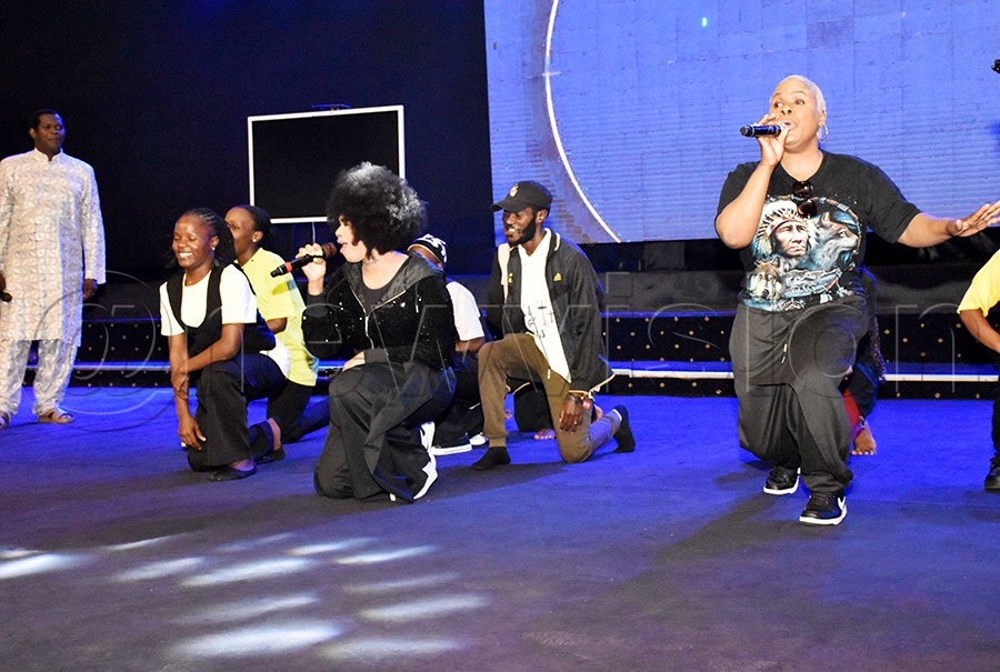Senior Pastor Robert Kayanja of Miracle Centre Cathedral dancing as Natalie Makoma and Pengani Makoma of the Makoma Band. Photo by Simon Peter Tumwine 