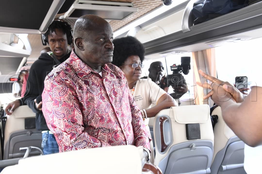 Gen. Katumba Wamala with Musenero during the inspection of the Kayola bus. (Credit: Mpalanyi Ssentongo)
